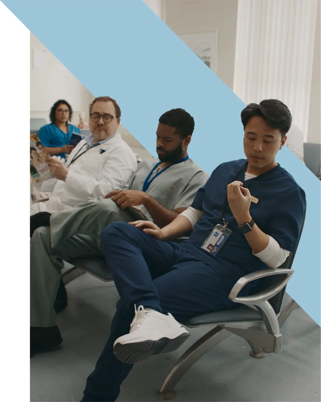 Several medical professionals sitting in a waiting room.